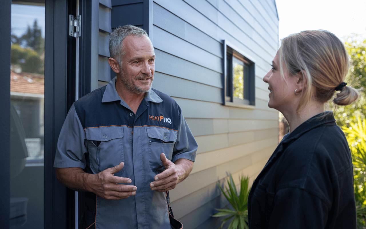 Heat Pump HQ owner Nate talking to the owner of a house in Christchurch